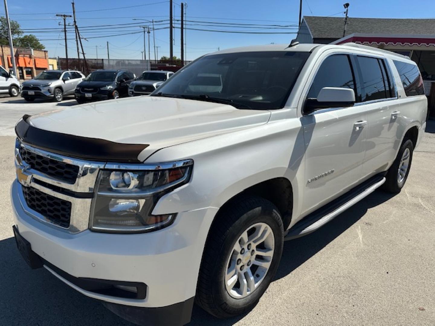 2015 Pearl White /Buckskin Chevrolet Suburban LT 1500 4WD (1GNSKJKC5FR) with an 5.3L V8 OHV 16V engine, 6-Speed Automatic transmission, located at 3200 1st Avenue North, Billings, MT, 59101, (406) 245-9055, 45.779270, -108.510742 - Very Nice Montana Trade-In. LT Package with Dual Power Leather Seats, Quad Seating, Power Moonroof, Power Lift Gate, Remote Start, Running Boards, 4X4, Lot of Miles but Well Taken Care Of and Way Less than Book Value! CarFax Dealer. Auto Brokers of Montana/AA&A Auto Rental/Fox Car Rental Billings - Photo#0