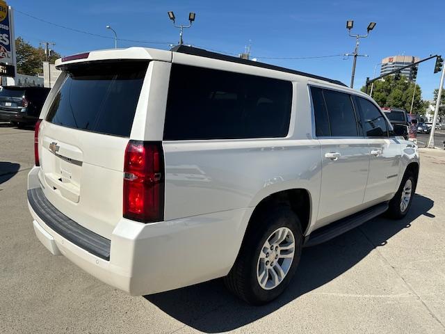 2015 Pearl White /Buckskin Chevrolet Suburban LT 1500 4WD (1GNSKJKC5FR) with an 5.3L V8 OHV 16V engine, 6-Speed Automatic transmission, located at 3200 1st Avenue North, Billings, MT, 59101, (406) 245-9055, 45.779270, -108.510742 - Very Nice Montana Trade-In. LT Package with Dual Power Leather Seats, Quad Seating, Power Moonroof, Power Lift Gate, Remote Start, Running Boards, 4X4, Lot of Miles but Well Taken Care Of and Way Less than Book Value! CarFax Dealer. Auto Brokers of Montana/AA&A Auto Rental/Fox Car Rental Billings - Photo#5