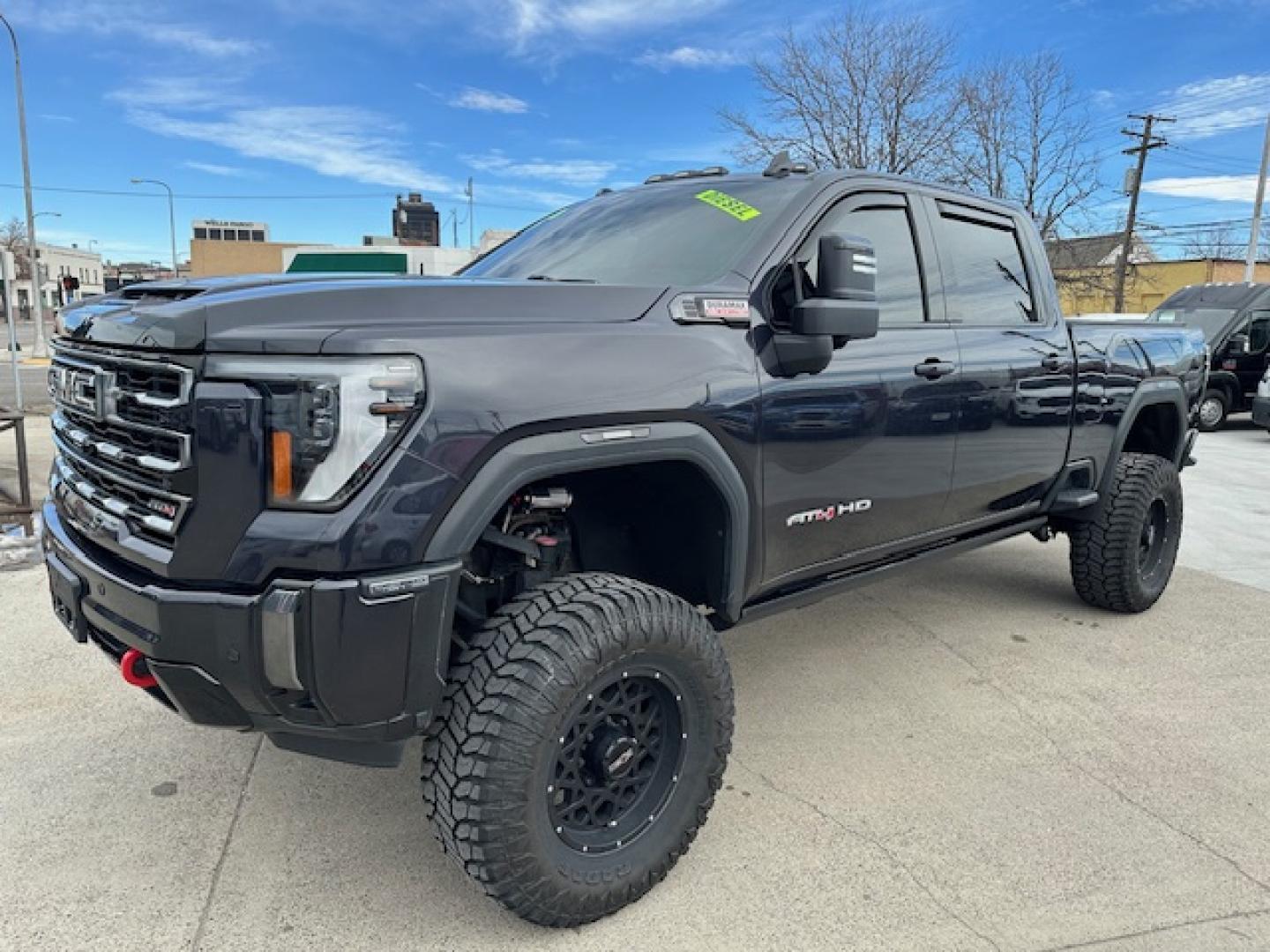 2024 Titanium Rush Metallic /Tu-Tone Leather GMC Sierra 2500HD AT4 Crew Cab 4WD (1GT49PEY3RF) with an 6.6L V8 OHV 16V TURBO DIESEL engine, 6A transmission, located at 3200 1st Avenue North, Billings, MT, 59101, (406) 245-9055, 45.779270, -108.510742 - A Gorgeous Truck with All the Options Including a Lift for Extra Clearance! Full LEather Interior with the Kalahari Accents, 6.6 DuraMax Diesel Power, Allison 10 Speed Automatic Transmission, Power Running Boards, Power Windows, Power Door Locks, Power Moon-Roof, Soft Tonneau Cover, Tow Package, Pa - Photo#0