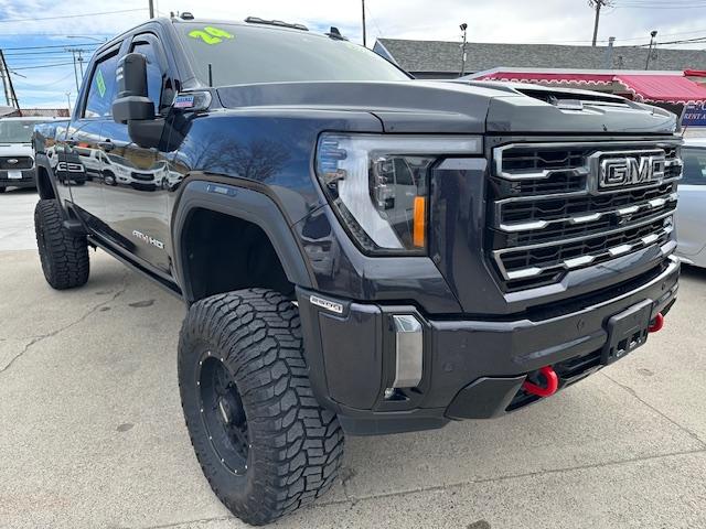 2024 Titanium Rush Metallic /Tu-Tone Leather GMC Sierra 2500HD AT4 Crew Cab 4WD (1GT49PEY3RF) with an 6.6L V8 OHV 16V TURBO DIESEL engine, 6A transmission, located at 3200 1st Avenue North, Billings, MT, 59101, (406) 245-9055, 45.779270, -108.510742 - A Gorgeous Truck with All the Options Including a Lift for Extra Clearance! Full LEather Interior with the Kalahari Accents, 6.6 DuraMax Diesel Power, Allison 10 Speed Automatic Transmission, Power Running Boards, Power Windows, Power Door Locks, Power Moon-Roof, Soft Tonneau Cover, Tow Package, Pa - Photo#2