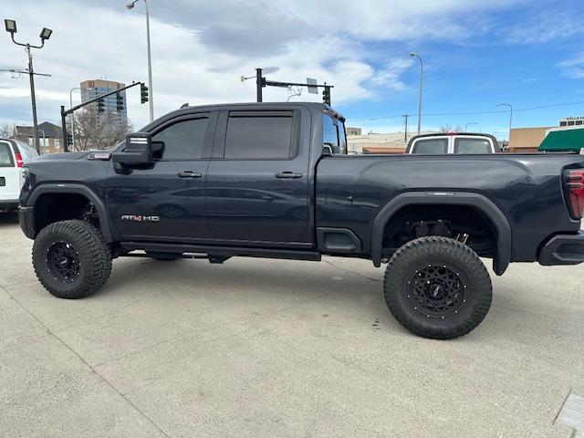 2024 Titanium Rush Metallic /Tu-Tone Leather GMC Sierra 2500HD AT4 Crew Cab 4WD (1GT49PEY3RF) with an 6.6L V8 OHV 16V TURBO DIESEL engine, 6A transmission, located at 3200 1st Avenue North, Billings, MT, 59101, (406) 245-9055, 45.779270, -108.510742 - A Gorgeous Truck with All the Options Including a Lift for Extra Clearance! Full LEather Interior with the Kalahari Accents, 6.6 DuraMax Diesel Power, Allison 10 Speed Automatic Transmission, Power Running Boards, Power Windows, Power Door Locks, Power Moon-Roof, Soft Tonneau Cover, Tow Package, Pa - Photo#6