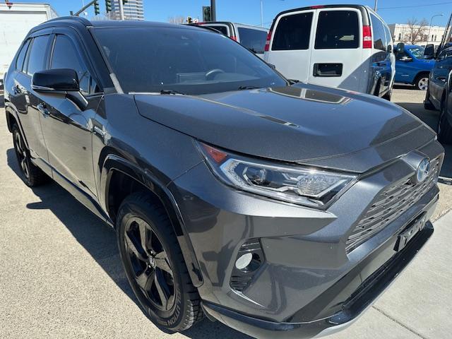 2021 Charcoal /Charcoal Gray Leather w/ Blue Highlights Toyota RAV4 Hybrid XSE (4T3E6RFV2MU) with an 2.5L L4 DOHC 16V HYBRID engine, CVT transmission, located at 3200 1st Avenue North, Billings, MT, 59101, (406) 245-9055, 45.779270, -108.510742 - Super Hard to Find Loaded Up Toyota Rav4 with Low Mileage. All Wheel Drive, Top of the Line XSE Model, Hybrid Powertrain, Power Seat, Power Moon Roof, Power Rear Hatch, Tu-Tone Exterior Trim Package Including Wheels, Power Windows, Power Door Locks, Navigation, Adaptive Cruise Control, Air Condition - Photo#2