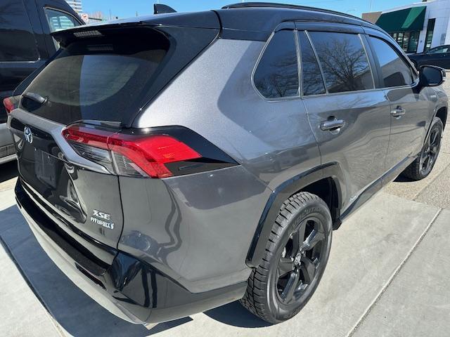 2021 Charcoal /Charcoal Gray Leather w/ Blue Highlights Toyota RAV4 Hybrid XSE (4T3E6RFV2MU) with an 2.5L L4 DOHC 16V HYBRID engine, CVT transmission, located at 3200 1st Avenue North, Billings, MT, 59101, (406) 245-9055, 45.779270, -108.510742 - Super Hard to Find Loaded Up Toyota Rav4 with Low Mileage. All Wheel Drive, Top of the Line XSE Model, Hybrid Powertrain, Power Seat, Power Moon Roof, Power Rear Hatch, Tu-Tone Exterior Trim Package Including Wheels, Power Windows, Power Door Locks, Navigation, Adaptive Cruise Control, Air Condition - Photo#4