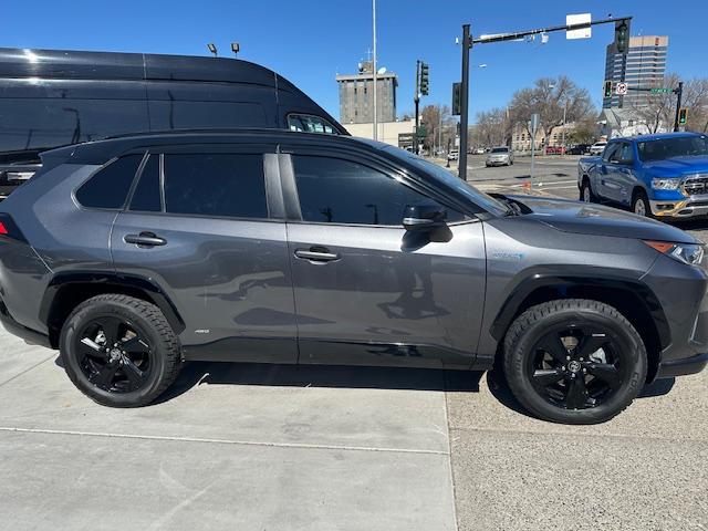 2021 Charcoal /Charcoal Gray Leather w/ Blue Highlights Toyota RAV4 Hybrid XSE (4T3E6RFV2MU) with an 2.5L L4 DOHC 16V HYBRID engine, CVT transmission, located at 3200 1st Avenue North, Billings, MT, 59101, (406) 245-9055, 45.779270, -108.510742 - Super Hard to Find Loaded Up Toyota Rav4 with Low Mileage. All Wheel Drive, Top of the Line XSE Model, Hybrid Powertrain, Power Seat, Power Moon Roof, Power Rear Hatch, Tu-Tone Exterior Trim Package Including Wheels, Power Windows, Power Door Locks, Navigation, Adaptive Cruise Control, Air Condition - Photo#3